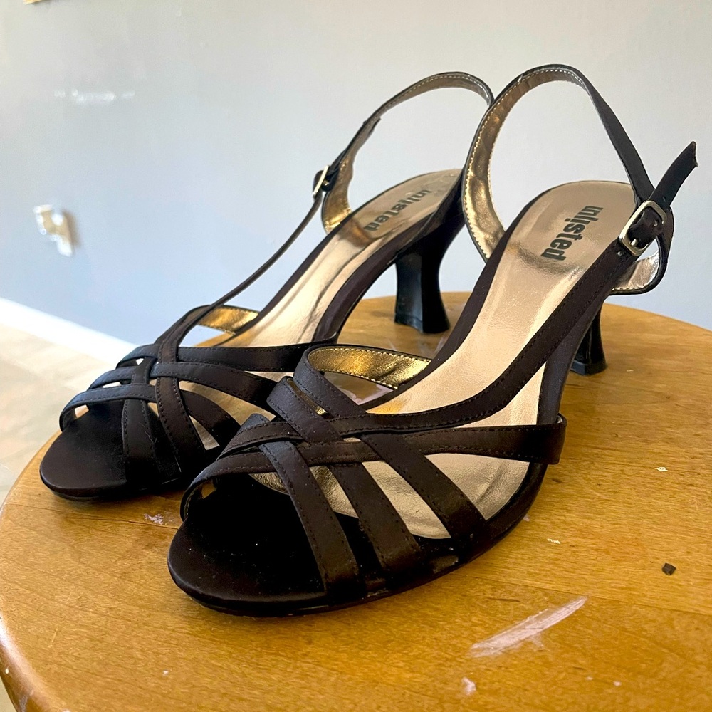 Black strappy kitten heels, secure and comfortable.